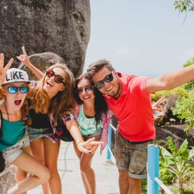 Happy hipster company of friends traveling around world Free Photo