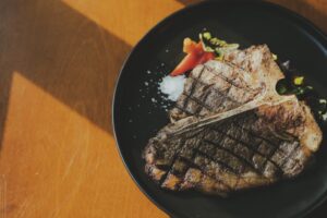 grilled meat on black plate